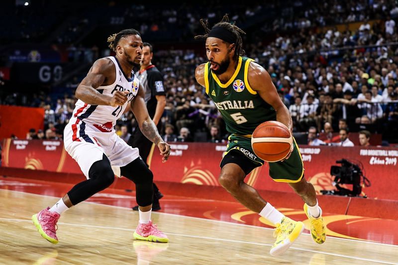 Patty Mills #5 of Australia dribbles the basketball.