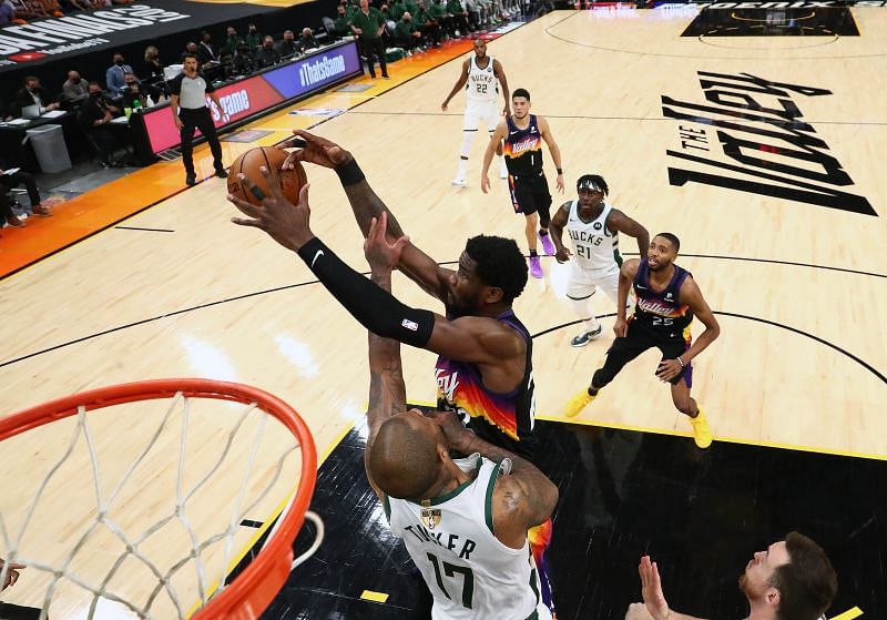 Deandre Ayton (22) plays for the rebound against P.J. Tucker (17) in Game 2.