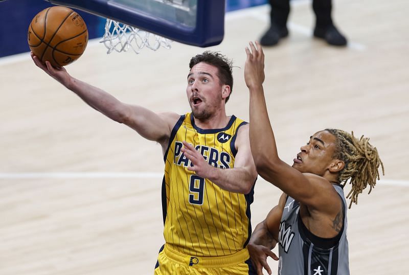 T.J. McConnell #9 of the Indiana Pacers shoots the ball against Nicolas Claxton #33 of the Brooklyn Nets