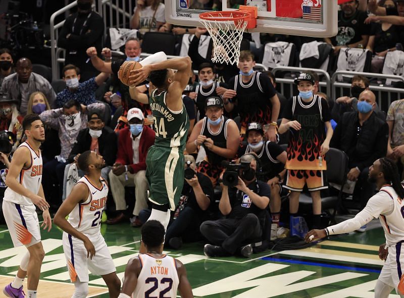 Giannis Antetokounmpo #34 goes up for a dunk.