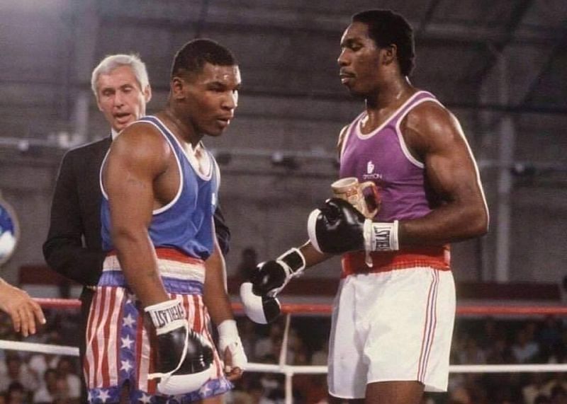 Mike Tyson (left) and Henry Tillman (right) [Photo credit: @HitFirstBoxing on Twitter]
