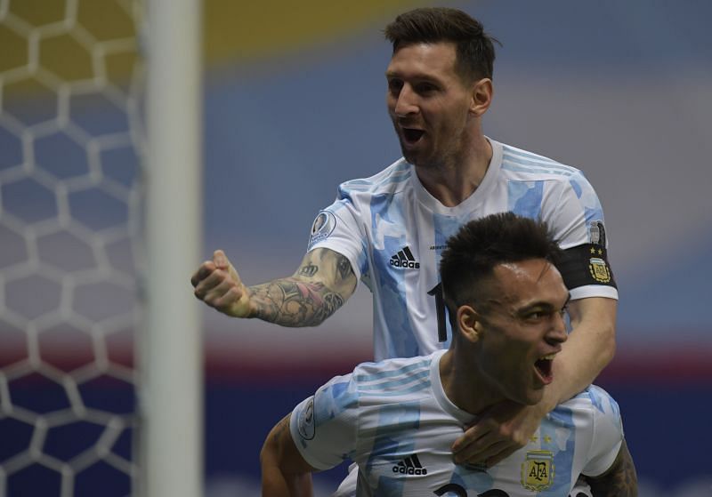 Lionel Messi celebrates the opening goal with Lautaro Martinez