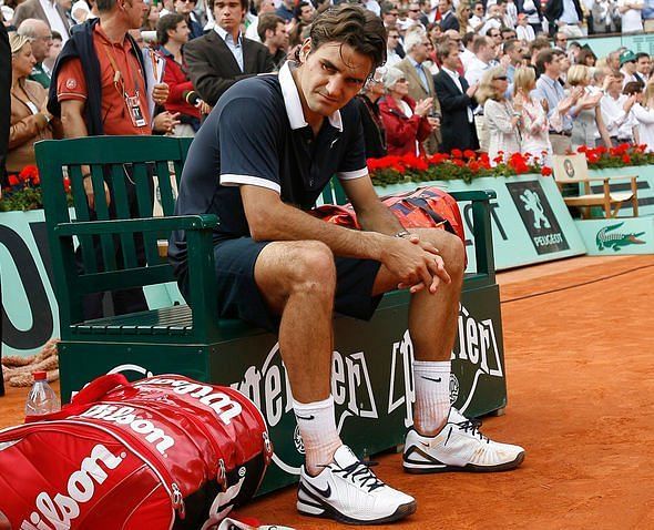 Roger Federer sits forlornly after receiving a hiding in the 2008 Roland Garros final.