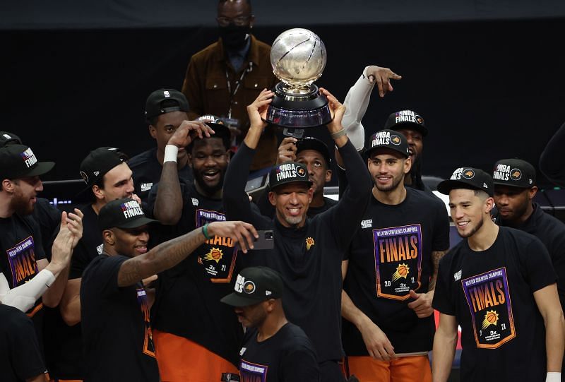 Head Coach Monty Williams of the Phoenix Suns holds the Western Conference Championship trophy after the Suns defeated the LA Clippers in Game Six of the Western Conference Finals