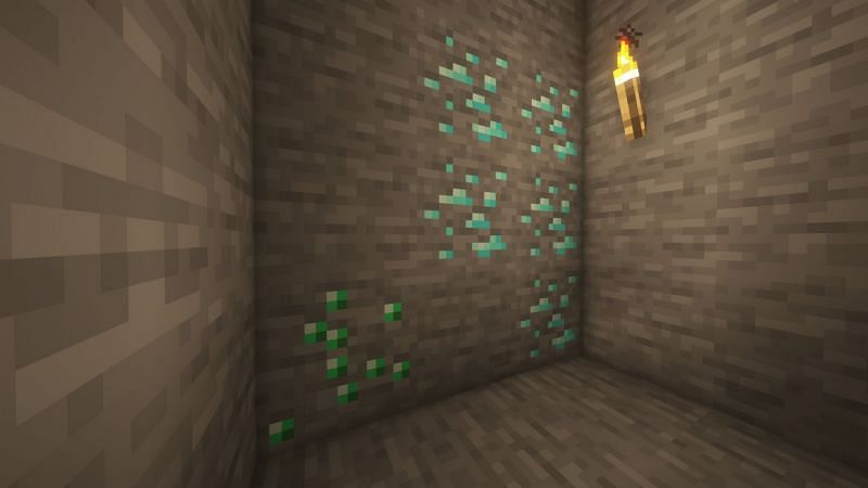 Diamond and emerald ore in the game (Image via Minecraft)