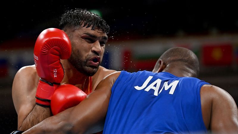 Satish Kumar (red) of Team India exchanges punches with Ricardo Brown of Team Jamaica during the Men's Super Heavy (+91kg) on Day 6 of Olympics 2021