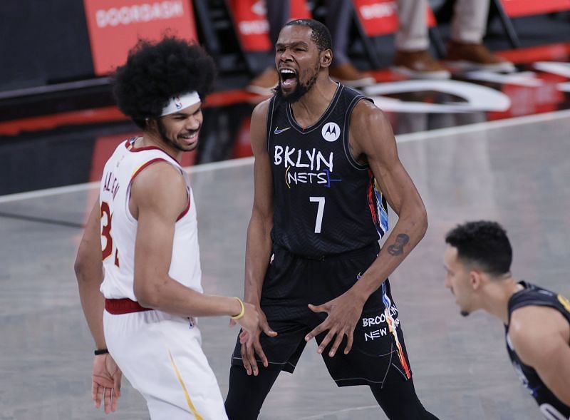 Kevin Durant #7 reacts after Jarrett Allen #31 beats him to the tip-off.