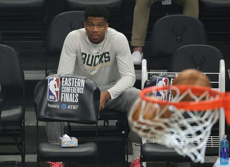 Giannis Antetokounmpo watches on from the sidelines