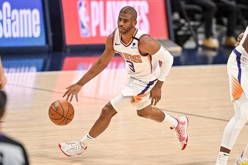 Chris Paul (#3) dribbles against the Denver Nuggets.