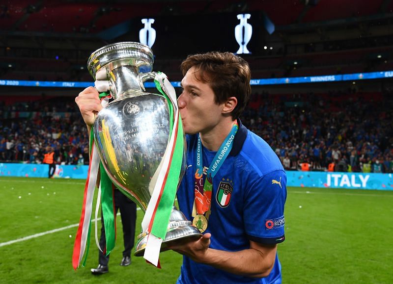 Federico Chiesa celebrates with the Euro 2020 trophy