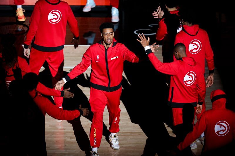 John Collins #20 of the Atlanta Hawks high fives teammates before the start of a game.