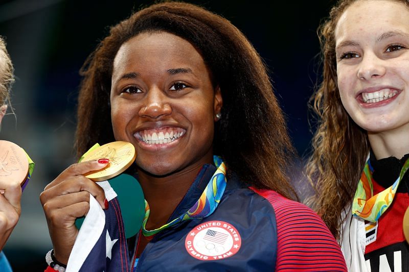 Gold medalist Simone Manuel of the United States celebrates during the medal ceremony for the Women&#039;s 100m Freestyle Final on Day 6 of the Rio 2016 Olympic Games