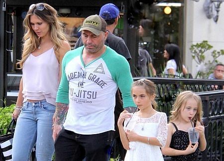 Joe Rogan with his wife and their daughters