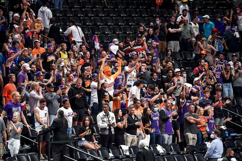 Phoenix Suns fans gather to applaud Chris Paul #3 of the Phoenix Suns after a win over the Denver Nuggets in Game Four of the Western Conference second-round playoff series at Ball Arena