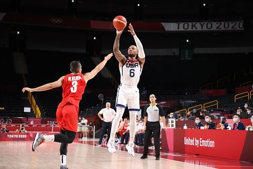 Damian Lillard (#6_ of Team United States goes up for a shot against Mohammadsina Vahedi (#3).