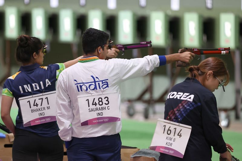 Manu Bhaker and Chaudhary Saurabh of Team India and Bomi Kim of Team Korea during the 10m Air Pistol Mixed Team Qualification on day four of Olympics 2021