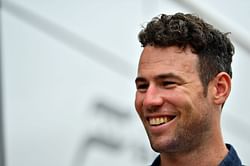 Tour de France drops charges against fan, Cavendish wins stage six