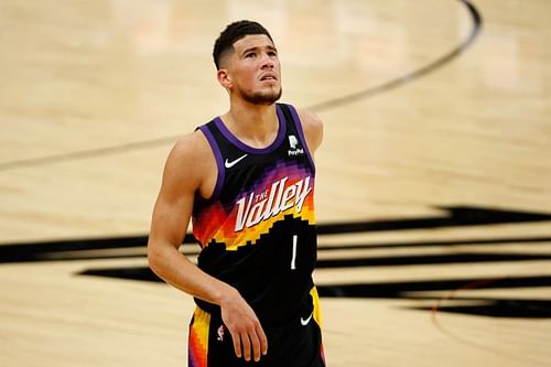 Devin Booker #1 looks up to the video board.