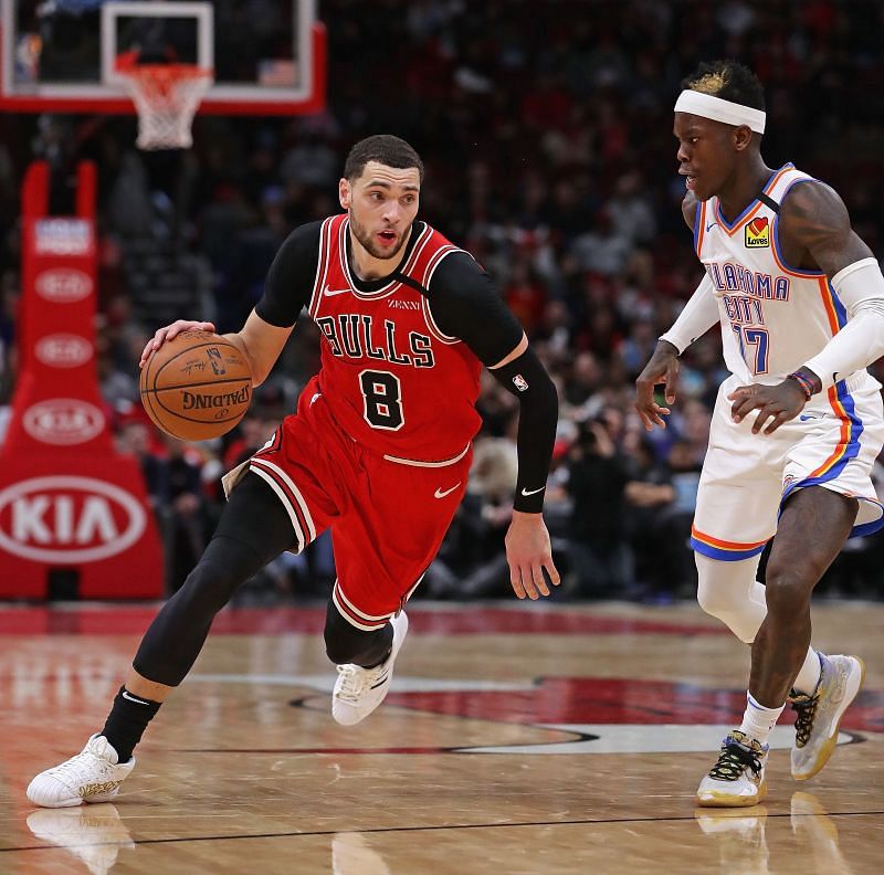 Zach LaVine #8 moves against Dennis Schroder #17.