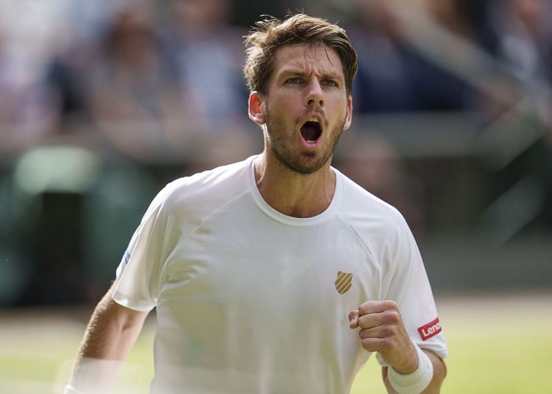 Cameron Norrie in action against Roger Federer