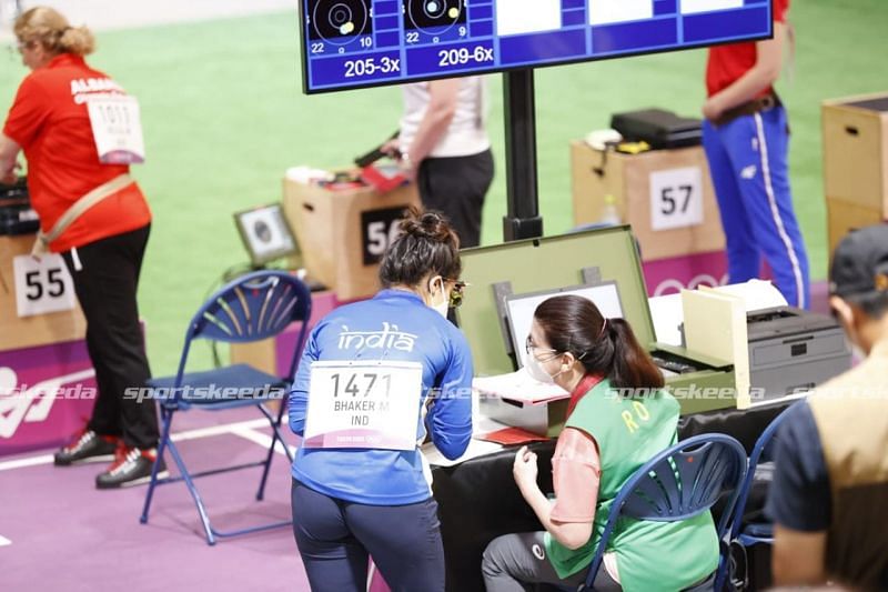 Manu Bhaker getting her pistol checked by the jury