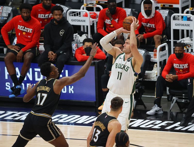 Brook Lopez of the Milwaukee Bucks shoots over Onyeka Okongwu