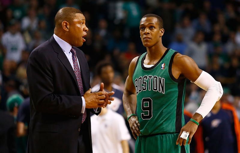 Head coach Doc Rivers of the Boston Celtics talks with Rajon Rondo