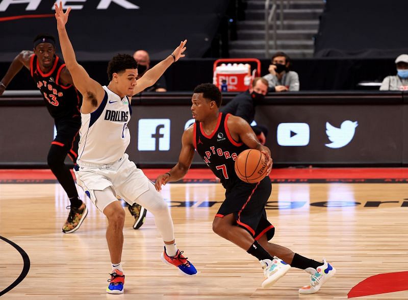 Josh Green (left) defends against Kyle Lowry (right)