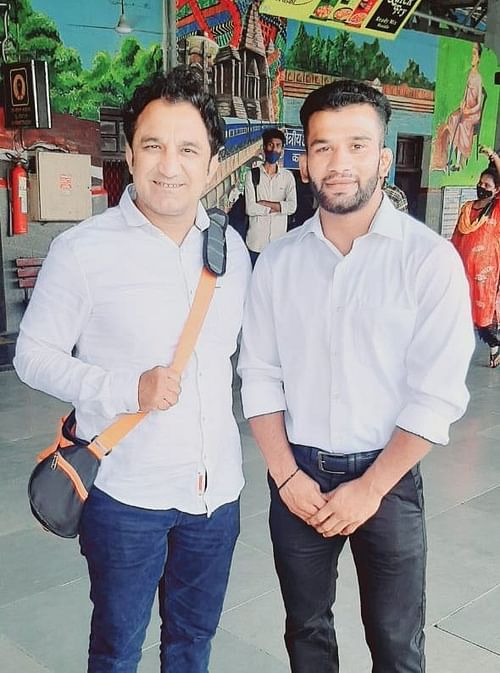 Sunny Jadhav (R) with Railway wrestling coach Kripa Shankar Patel