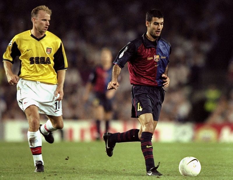 Josep Guardiola (R) in action against Arsenal