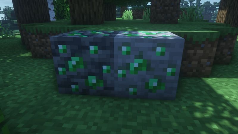 Emerald ore next to its deepslate variant (Image via Minecraft)