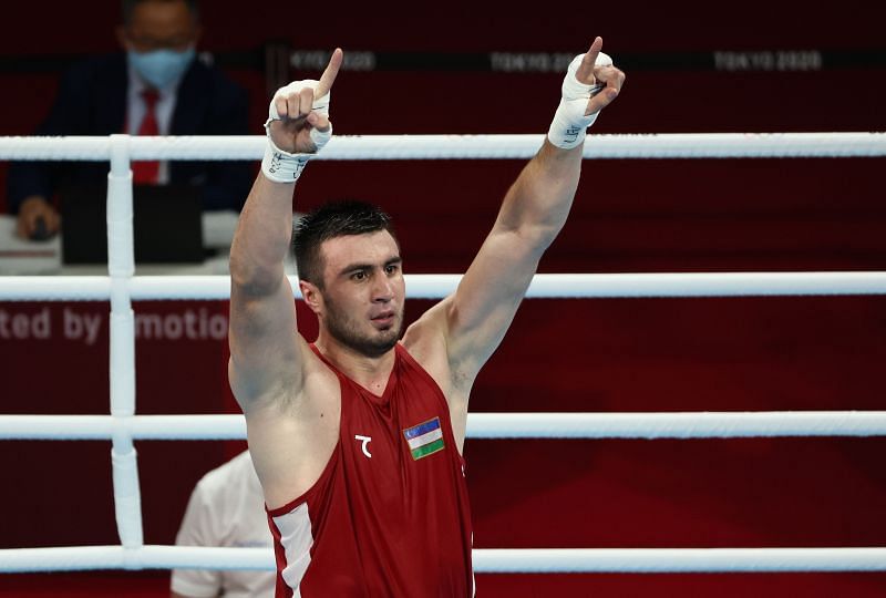 Bakhodir Jalolov celebrates his Olympics 2020 win over Satish Kumar