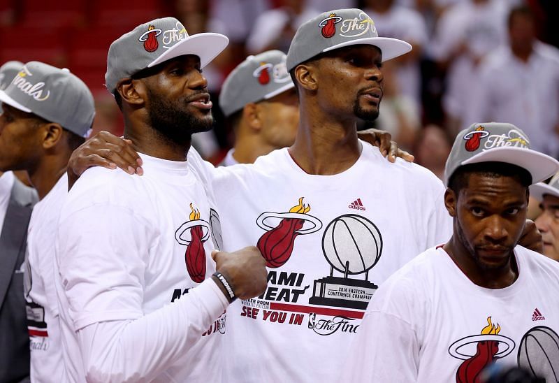 LeBron James (#6), Chris Bosh (#1) and Toney Douglas (#0) of the Miami Heat