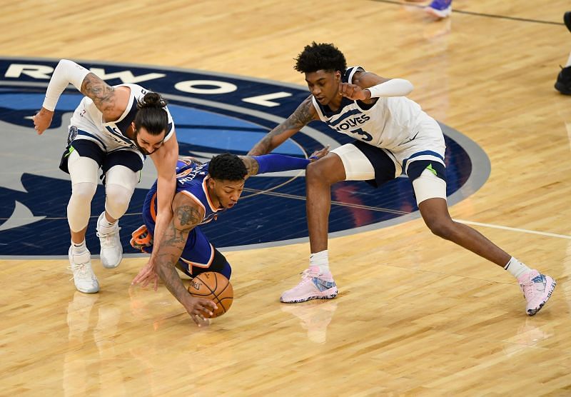 Jaden McDaniels (right) in action