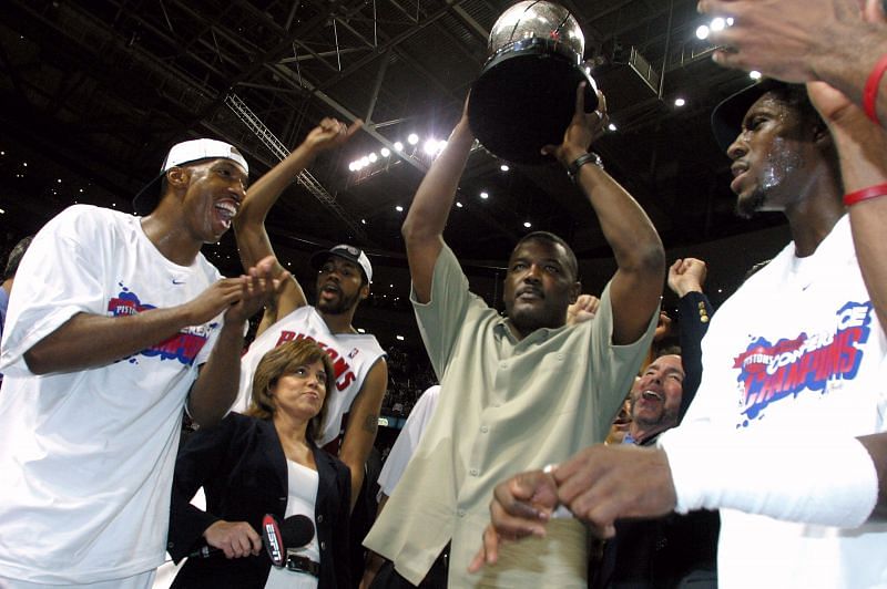 Chauncey Billups #1, Rasheed Wallace #30, President of Basketball Operations Joe Dumars (holding trophy) and Ben Wallace #3 of the Detroit Pistons