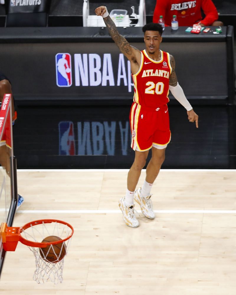 John Collins #20 of the Atlanta Hawks lands a three pointe