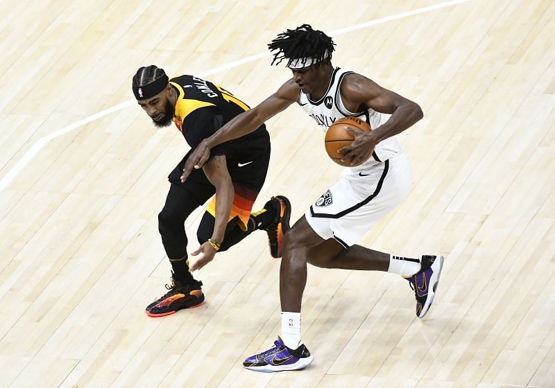 Alize Johnson #(24) fights for the ball with Mike Conley (#10).
