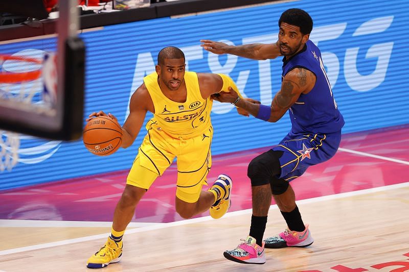 Chris Paul (left) dribbles past Kyrie Irving (right) in the 2021 NBA All-Star Game