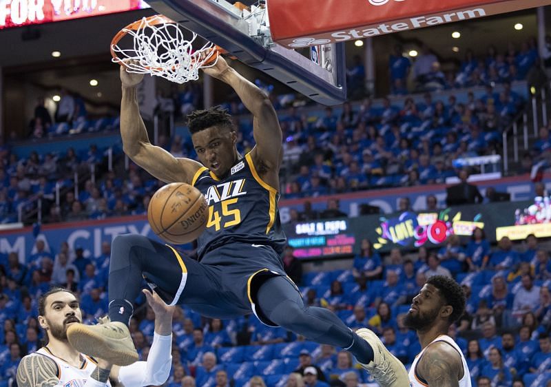 Donovan Mitchell dunks the ball in a match against the Oklahoma City Thunder