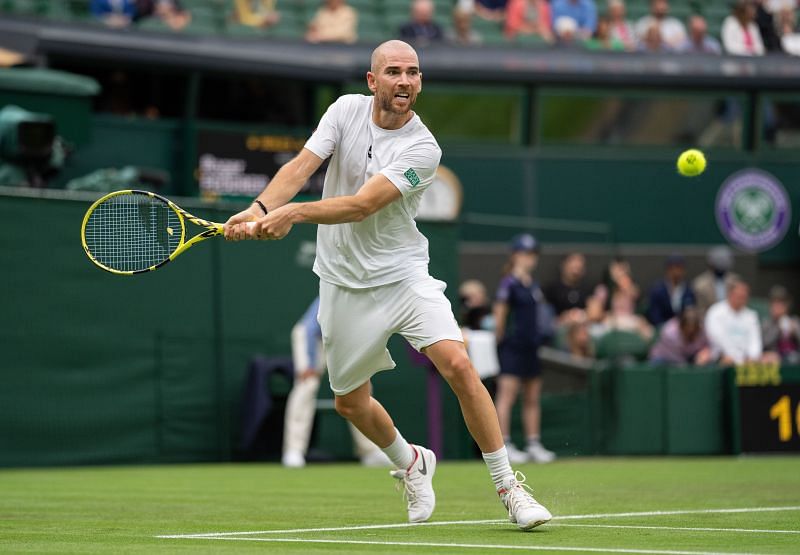 Adrian Mannarino retrives a ball during the first round of the 2021 Wimbledon Championships