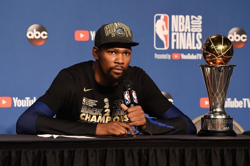 Kevin Durant with the 2018 NBA Finals MVP trophy