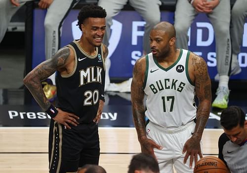 John Collins (#20) and PJ Tucker (#17).