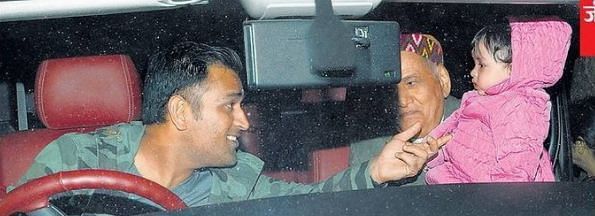 MS Dhoni and his daughter with his father