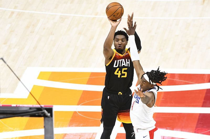 Donovan Mitchell shoots the ball during an NBA game.