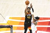 Donovan Mitchell shoots the ball during an NBA game.