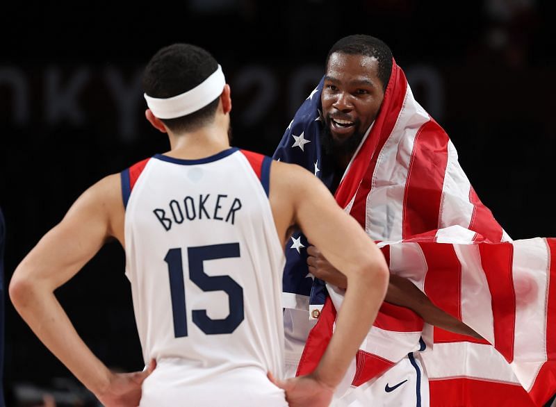 Kevin Durant #7 and Devin Booker #15 celebrate following their victory over France.
