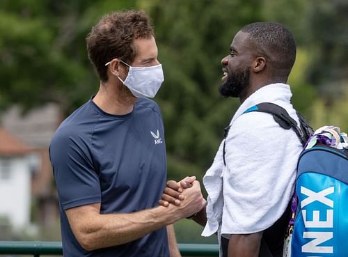 Andy Murray greets Frances Tiafoe at Wimbledon 2021