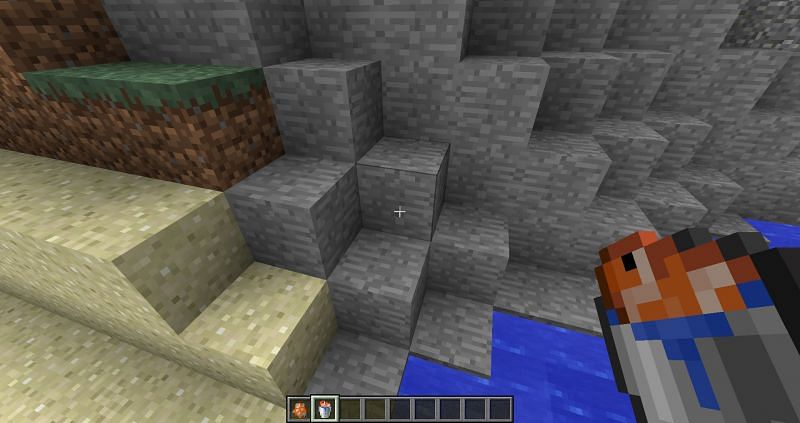 Bucket of fish in the players inventory (Image via Minecraft)
