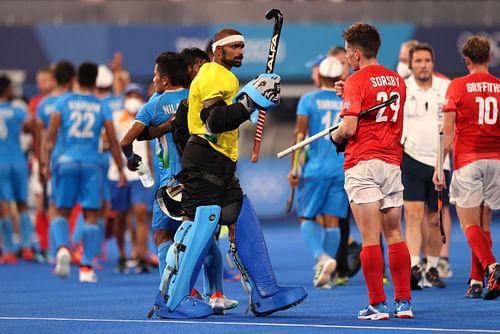 PR Sreejesh of India and Thomas Sorsby of Great Britain fist bump following India's win over Great Britain in the Men's Quarterfinal match at Tokyo Olympics.