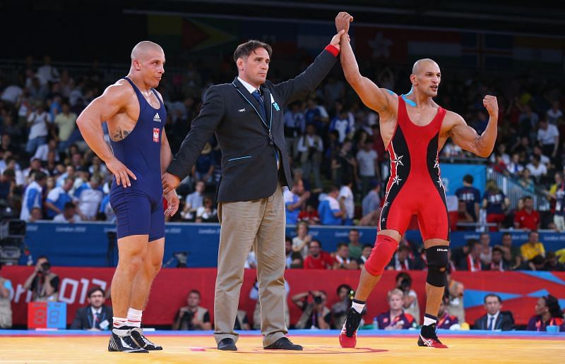 Karam Gaber gets his hand raised at the Olympics.